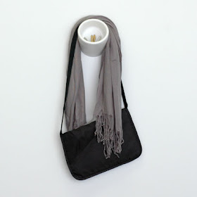 hook and cubby combination, with scarf and purse draped over the hook