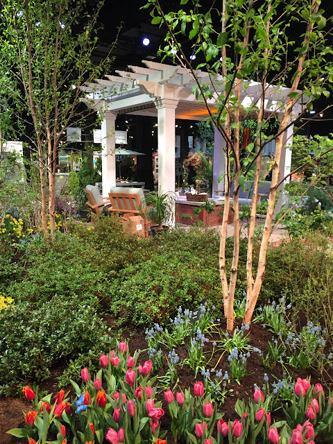 This here is my dream backyard | Pergola with comfy seating and gardens galore! | Boston Flower & Gift Show 2017