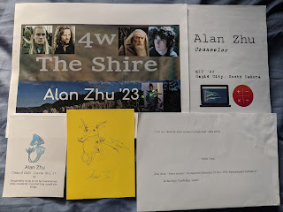 five door signs; clockwise, from top left: a next house 4W door sign, an RSI door sign, an MLA formatted Asymptones quote, a hand-drawn Pikachu, and a Pokemon Next House door sign (the Pokemon is Azelf)