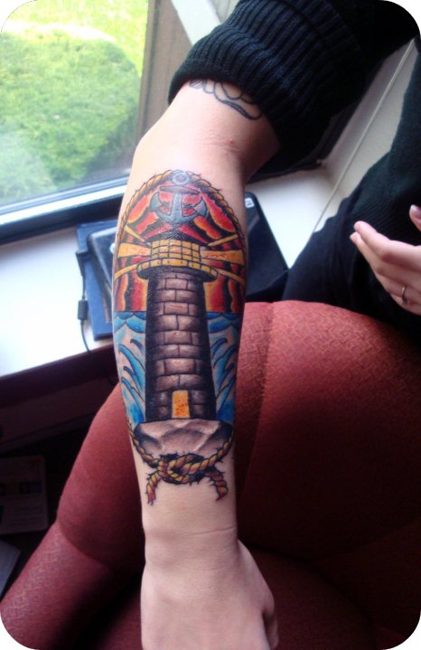 Featured tattoo/location: Lighthouse on right forearm.