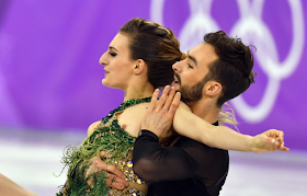 The pair were still able to finish as Papadakis tried in vain to keep her chest covered.