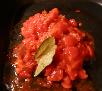 Tomatoes and Wine Vinegar Mixture Added to Frying Pan