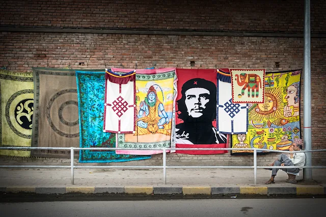 Shiva, Che Guevara and various other rugs on sale on the streets of Kathmandu in 2016