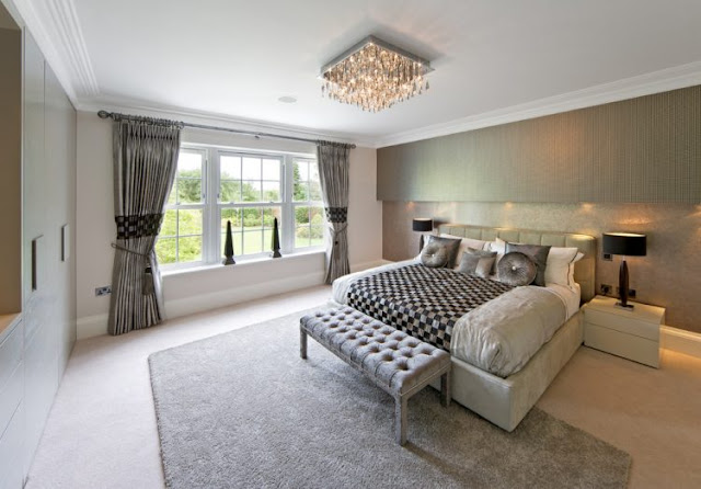 Gray Bedroom With Crystal Chandelier