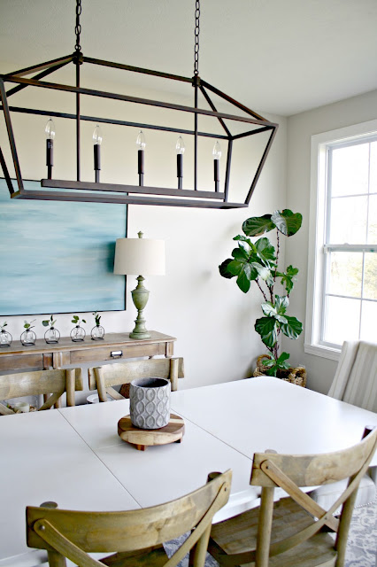 long white table with wood chairs