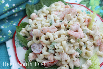 Shrimp and Macaroni Salad from Deep South Dish blog. A macaroni salad made with shrimp, celery and green onion, and dressed with a blend of seasoned mayonnaise and sour cream. Sliced grape tomatoes are tossed in just before serving.