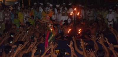 This image shows a Kecak dance, a traditional Balinese dance. The Kecak dance is performed by a group of men who chant the word cak in a rhythmic fashion.