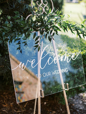 acrylic welcome signage on easel