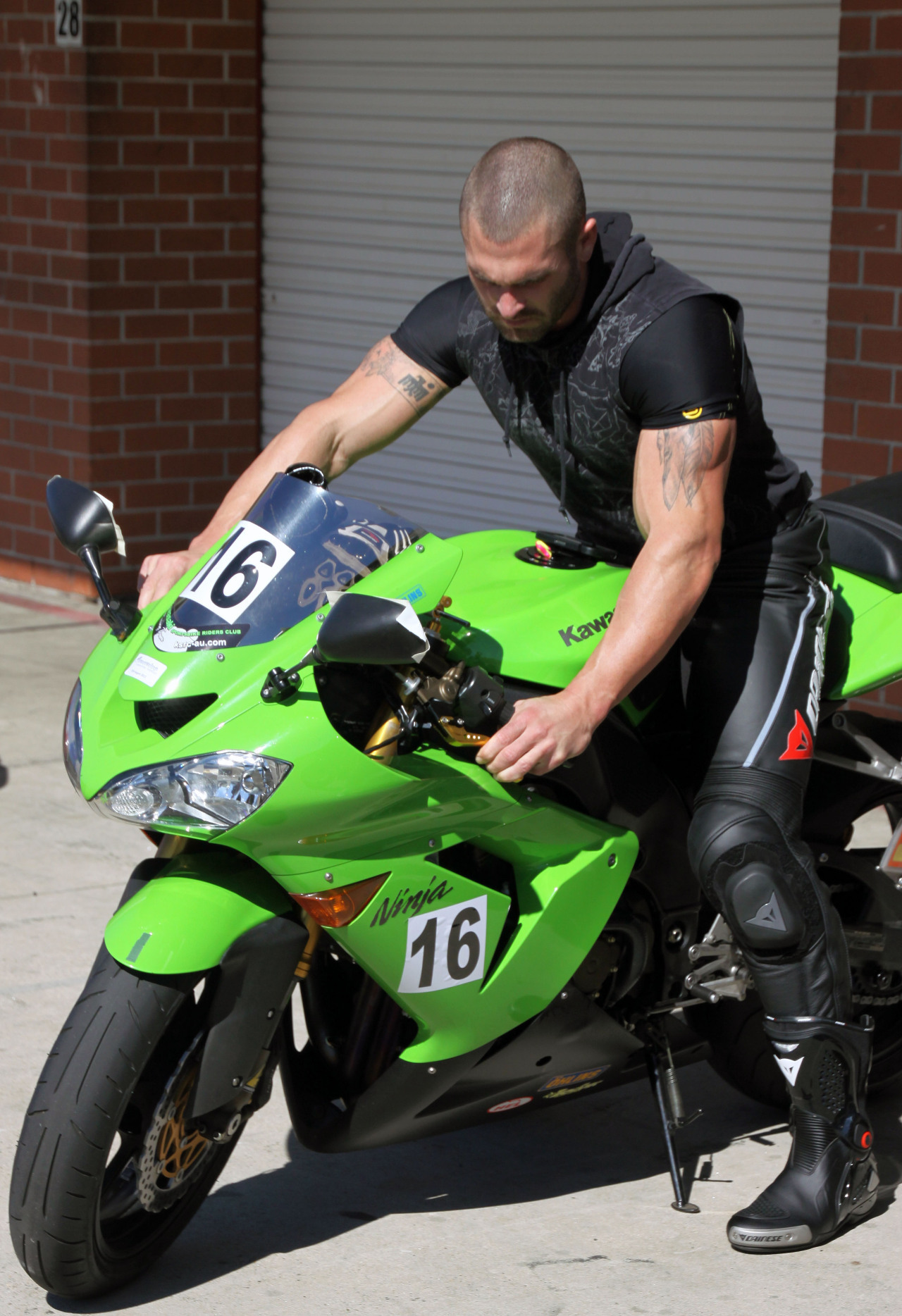 straight-hot-masculine-man-riding-green-motorcycle