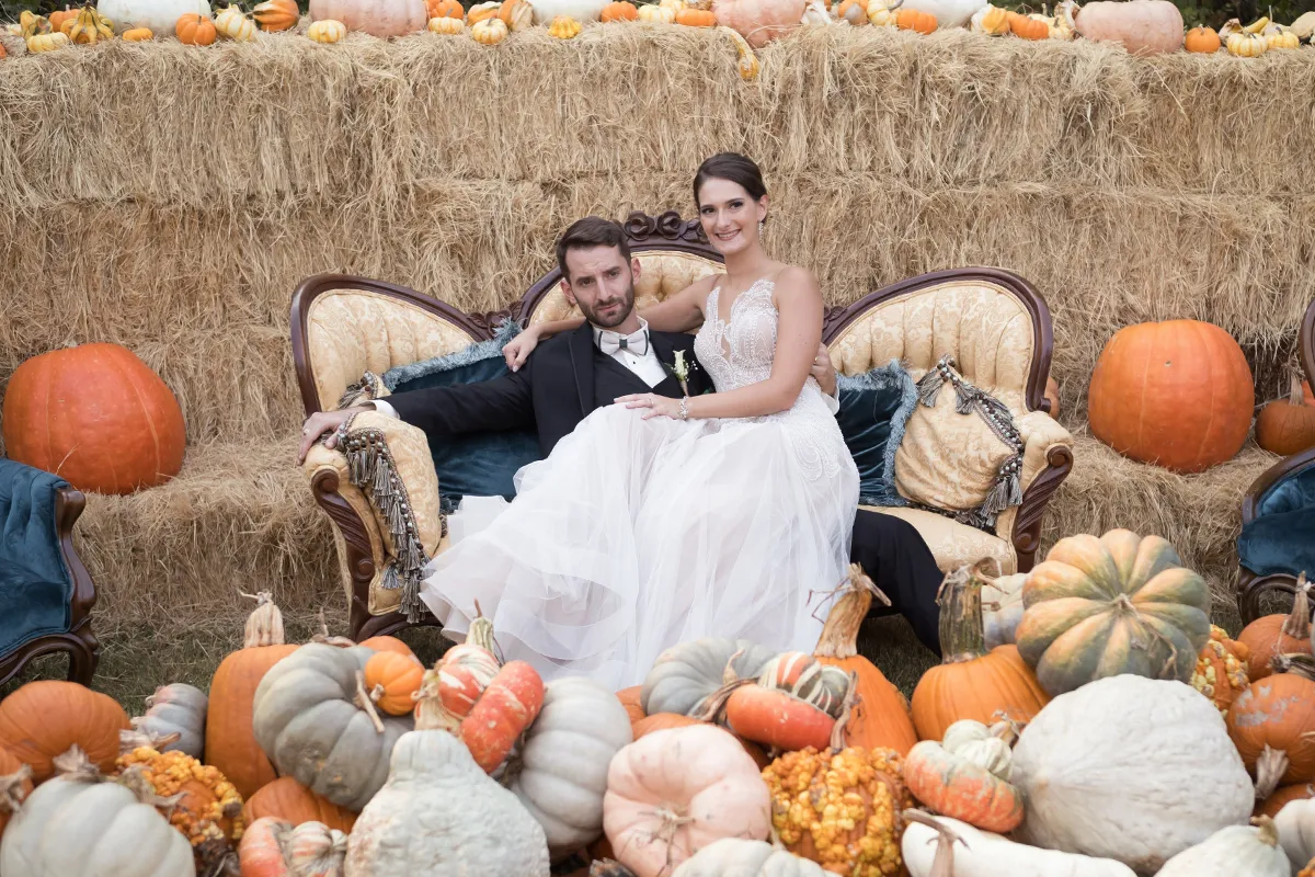 newly-wed couple at a pumpkin patch wedding