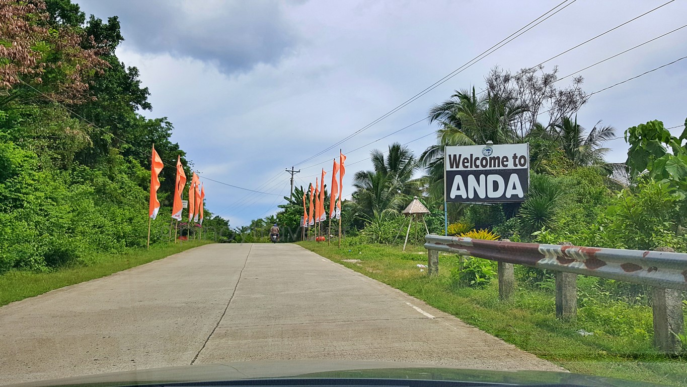 welcome sign at the boundary between the towns of guindulman and anda bohol