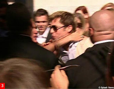 photos of the moment a crazed fan attacked Brad Pitt in Venice