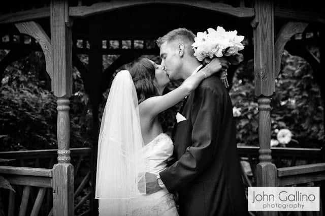 Bride and Groom kiss at Seasons Catering