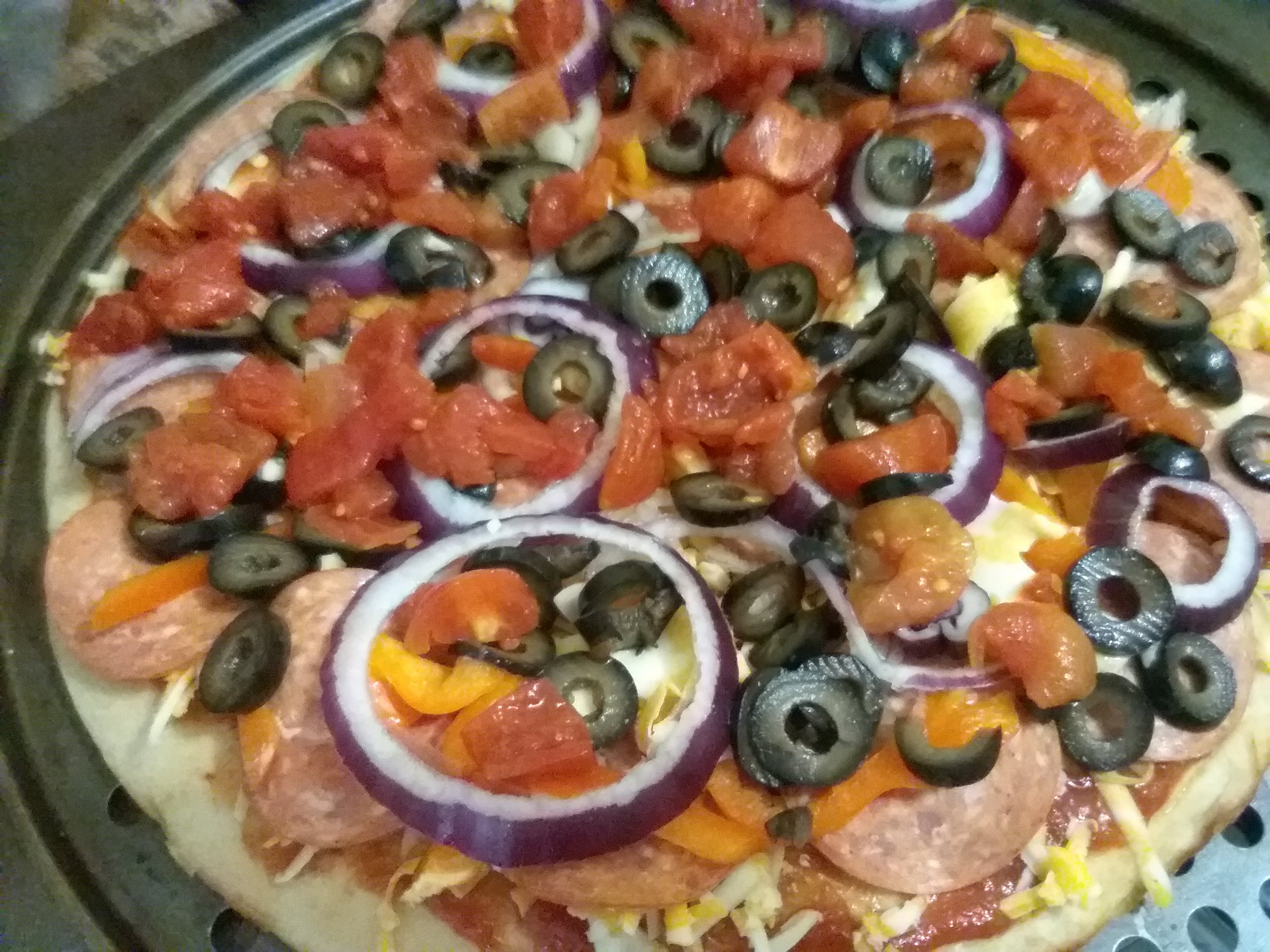 Pepperoni pizza with black olives