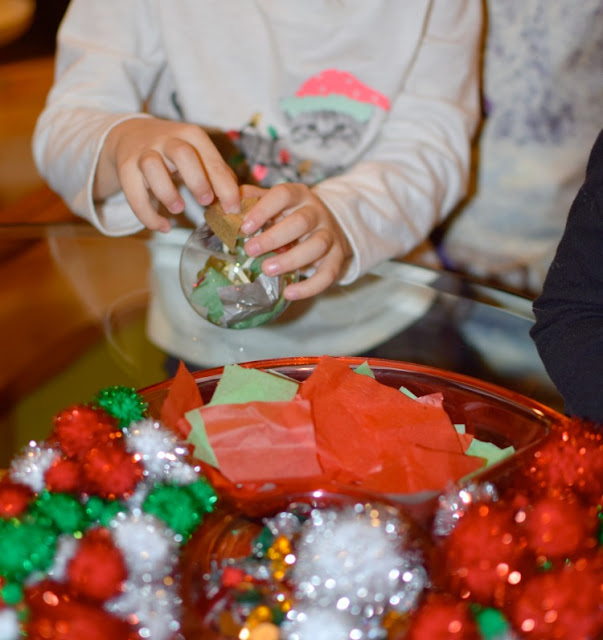 Set up a Christmas ornament station for preschool, kindergarten, or elementary class party.  Let kids add different Christmas goodies to work on fine motor skills and make a beautiful keepsake ornament to take home!