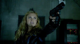 Clarke holding someone at gunpoint
