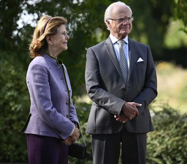 Queen Silvia wore a lilac wool tweed jacket with green trim border by Zara, Chanel. The Queen wore her wool purple trousers