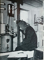 An Endurance crew member observing a scientific experiment instrument.