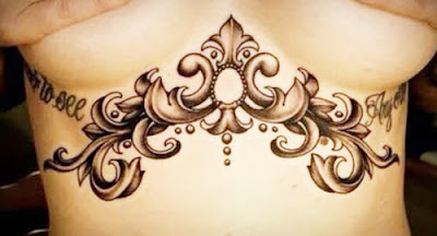 Woman chest tattoos under the breasts