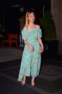 Elle fanning turquoise floral print off-the-shoulder dress paired with Prada’s silver metallic leather mules