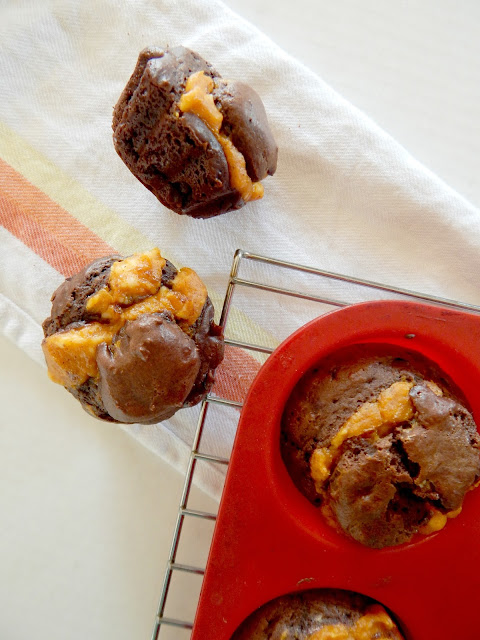 Pumpkin Cheesecake Mocha Muffins...the perfect sweet bit with your morning coffee!  Rich, deep chocolate with a creamy pumpkin filling, studded with coffee flavor! (sweetandsavoryfood.com)