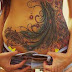 Women Lower Hip Black Bird Feather Tattoo Designs