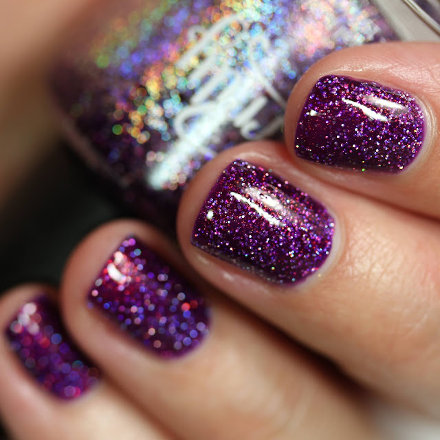 purple nail polish with holographic glitter and shimmer