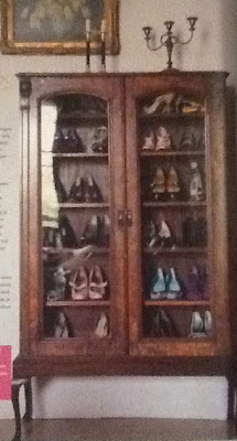 Shoes in an antique cabinet storage