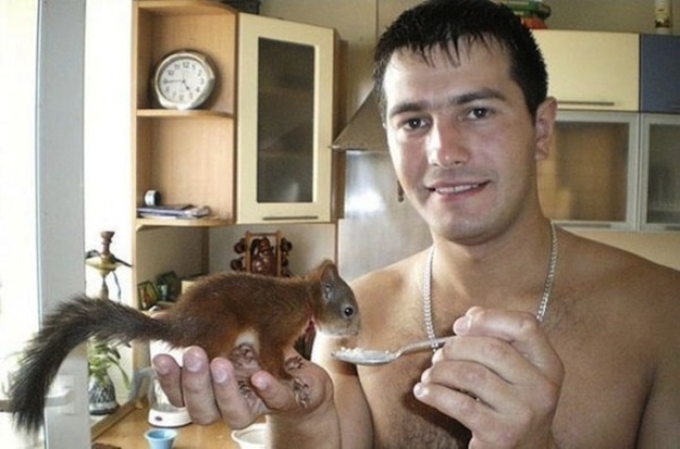 Belarusian soldier rescued baby squirrel and now they're best friends, a soldier and squirrel, baby squirrel