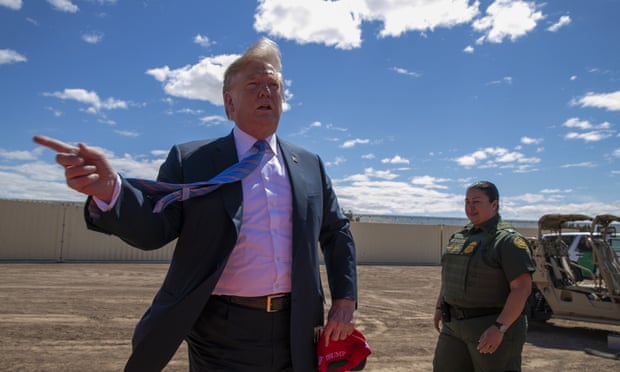  Donald Trump visits a new section of the border wall with Mexico in Calexico, California