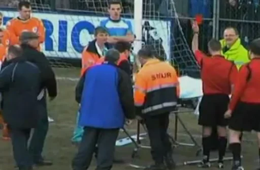 Julien Lecomte is shown red card whilst being carried off on a stretcher