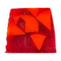 A square piece of red soap with some 3d cranberries designed on top of it on a bright background