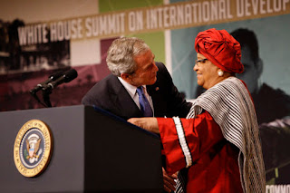 President George W. Bush embraces Liberian President Ellen Johnson Sirleaf