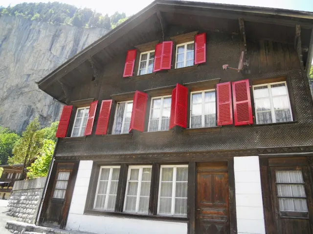 Chalet with red shutters in Lauterbrunnen Switzerland