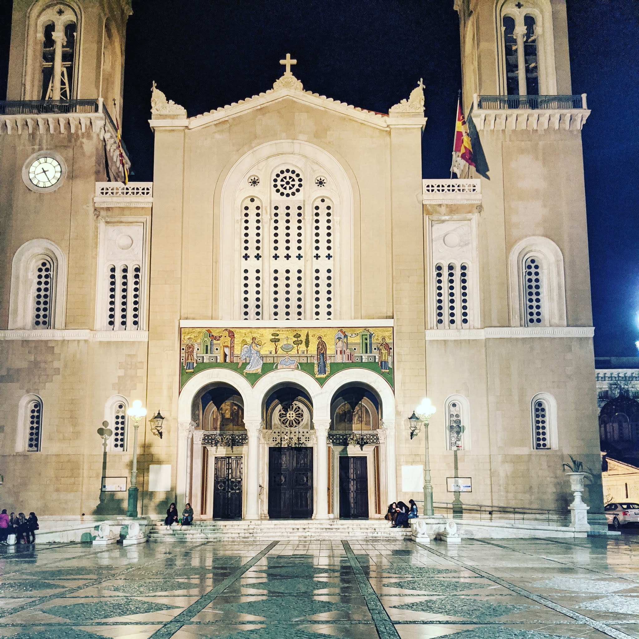 The Metropolitan Church of Athens at night, with beams of light shining down. It's one of the best things to see during a weekend in athens
