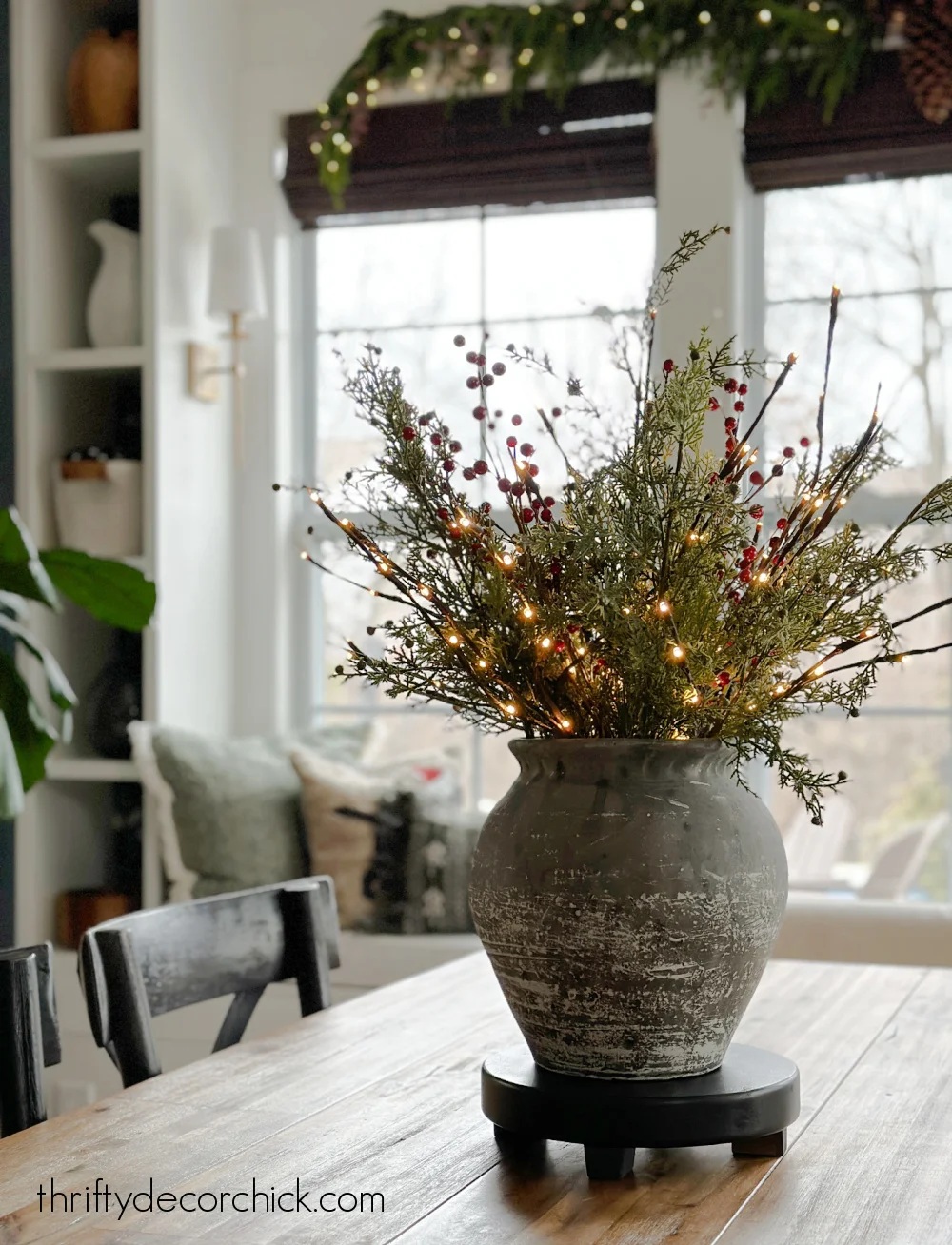 vase with lighted branches