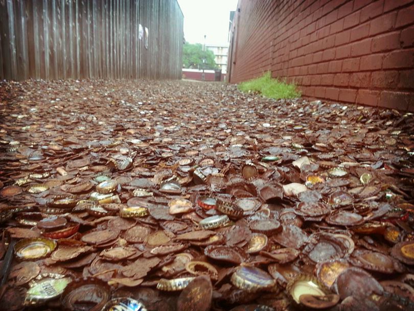 Bottle Cap Alley, a street paved with around four decades of discarded beer and soda bottle caps. An alley in Texas, USA, has become famous and attract lots tourist