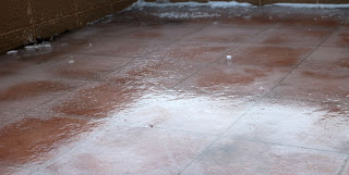 A sheet of ice over the tiles