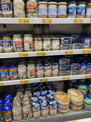 canned fish section in Auchan grocery store in Poland