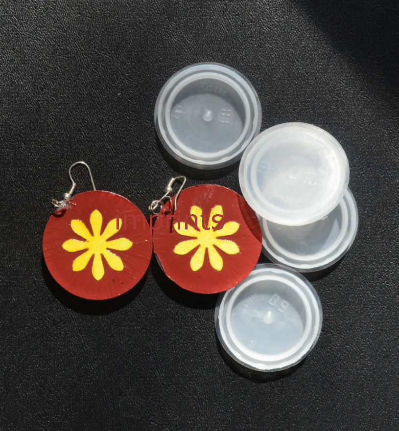 http://www.imprintshandmade.com/2013/04/plastic-water-jug-cap-earrings-my_24.html