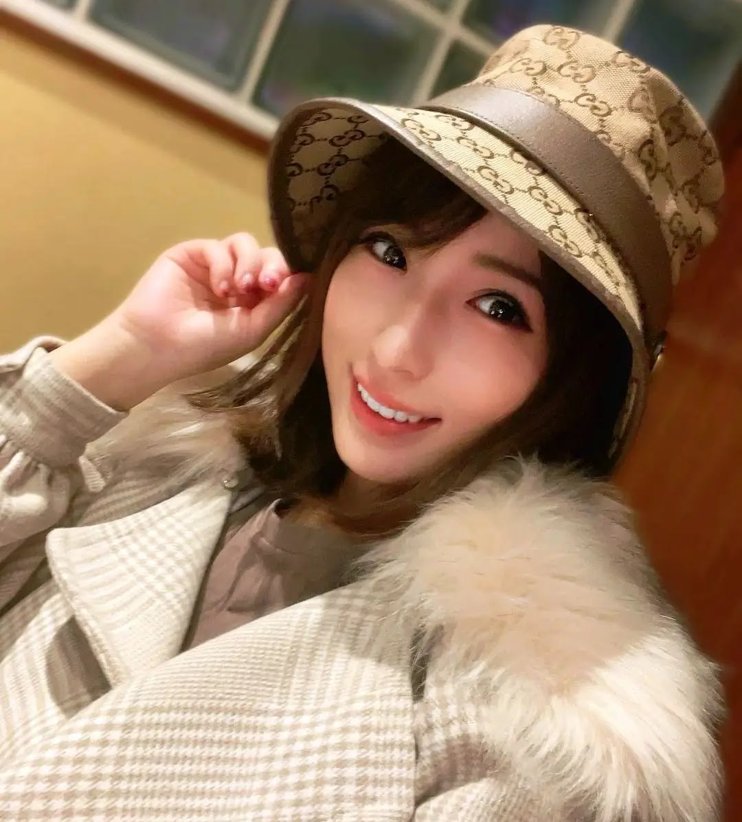 Nami Hoshino wearing hat and white jacket