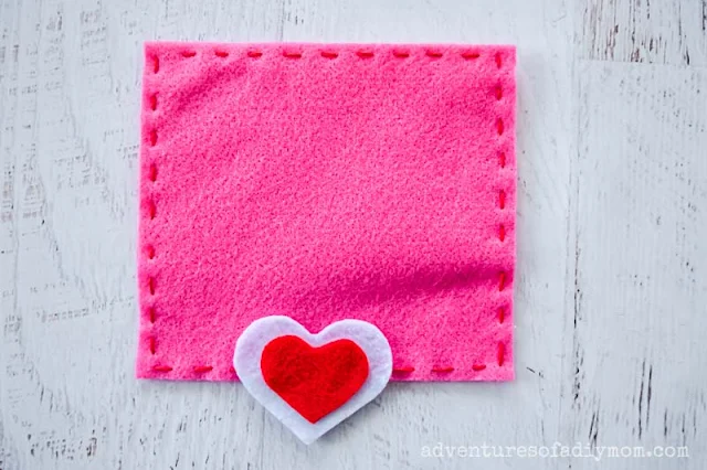 adding felt hearts to top flap of envelope