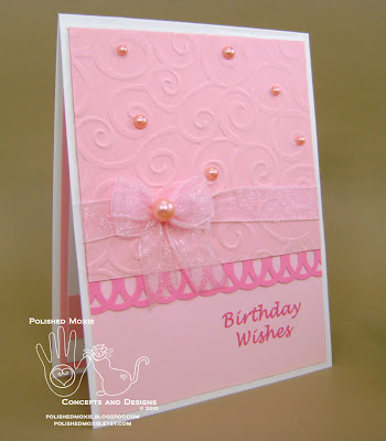 Front of my handmade girly pink birthday card sitting at a right angle.