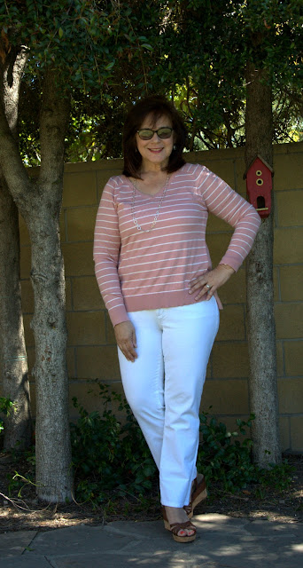 white jeans and pink striped sweater