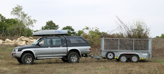 A trailer full of brush wood