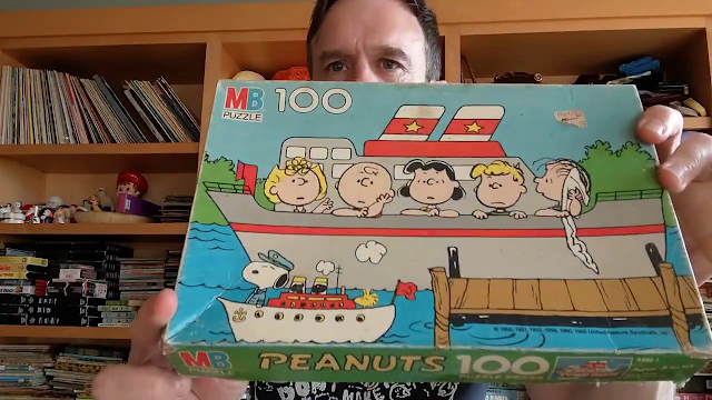 picture of man holding box with illustrations