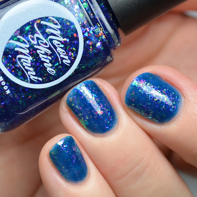 blue jelly nail polish with color shifting flakies swatch