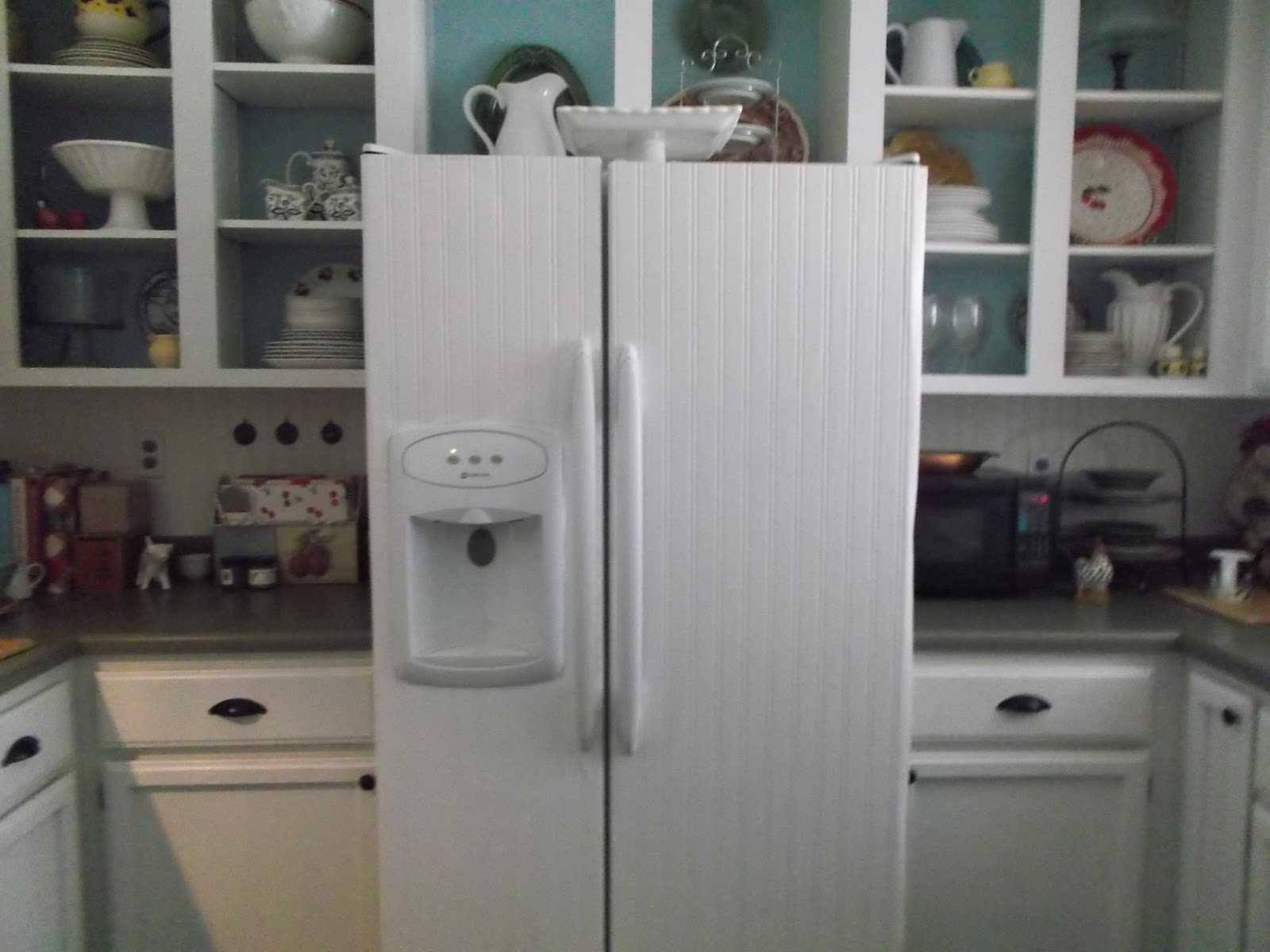 just measured the refrigerator doors and cut the wallpaper to fit. I ...