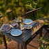 A rustic kitchen and favorite table under the fig tree