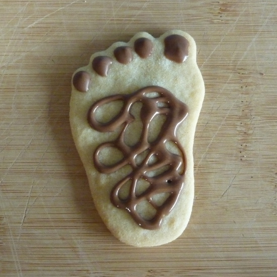 Chocolate detail icing on cookie foot feet